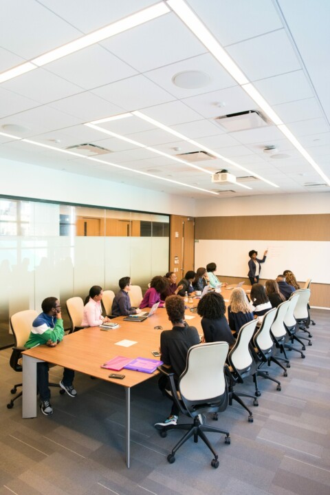 people in a boardroom having a meeting