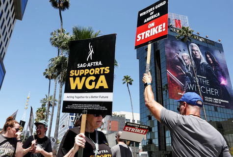 SAG-AFTRA members walk the picket line in solidarity with striking WGA workers